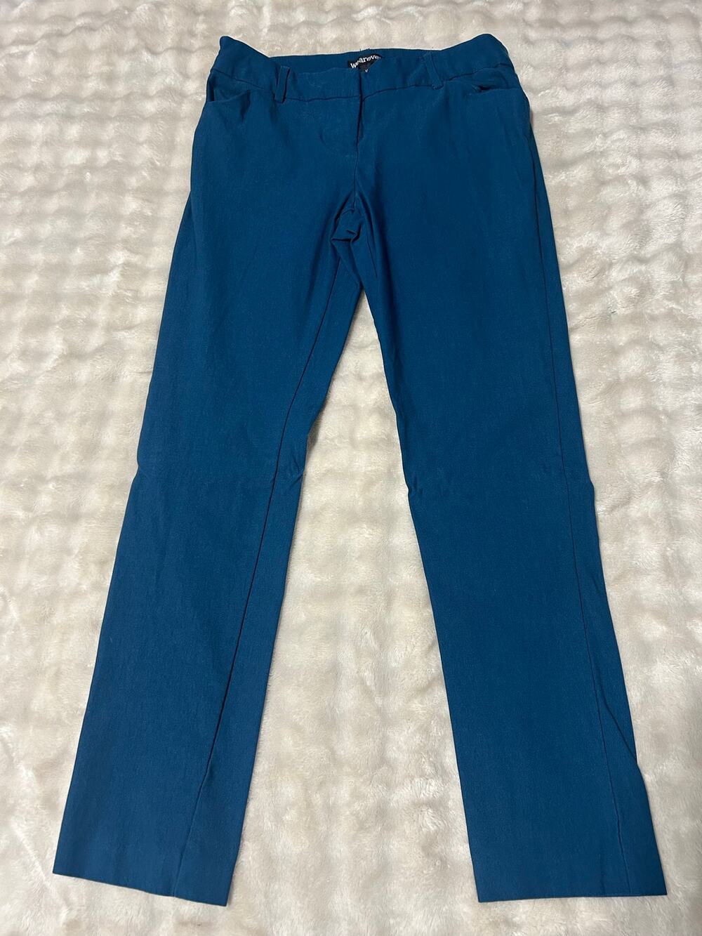 Woman’s teal colored pants